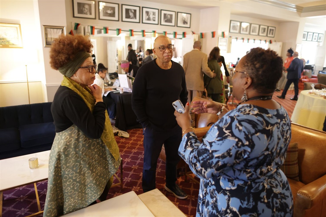 Three attendees chatting at the 2024 Black History Month Honors Celebration